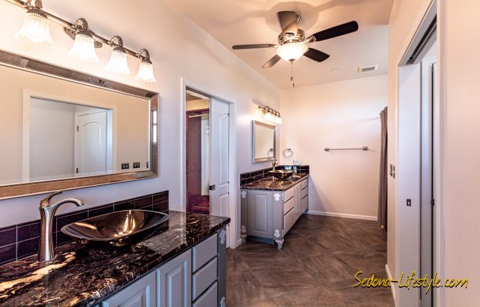 Primary Suite Bath with separate vanities and oversize walk-in close, at 2835 S. Quail Canyon Rd, Cottonwood AZ 86326 - For Sale - Call Sheri Sperry for all your real estate needs at 928.274.7355