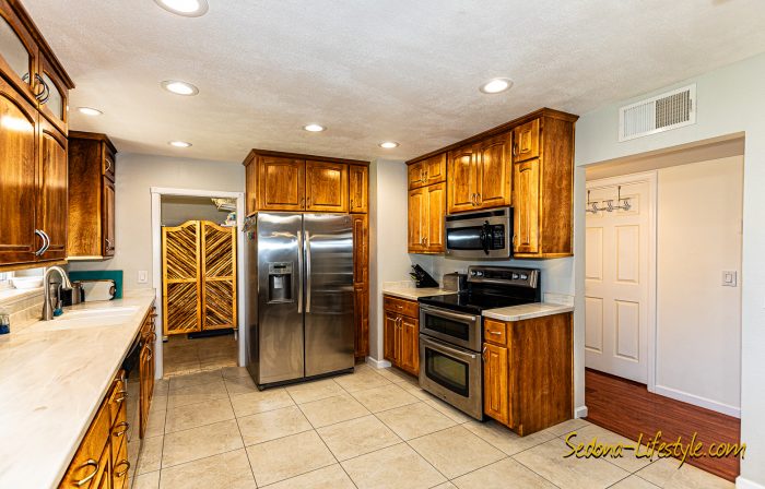 Kitchen with entry to pantry, washer and dryer and water heater and eater systems - - Call Sheri Sperry @ 928.274.7355 for all your real estate needs.