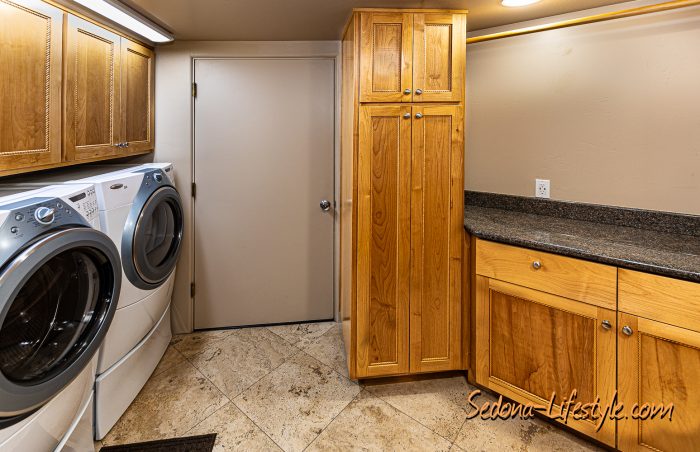 Laundry Room leads to three car garage.