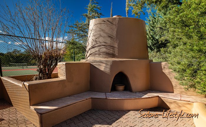 Outdoor Kiva fireplace at pickle ball courts Casa Contenta - call Sheri Sperry of Coldwell Banker at 928.274.7355 Outdoor Kiva fireplace at pickle ball courts Casa Contenta - call Sheri Sperry of Coldwell Banker at 928.274.7355